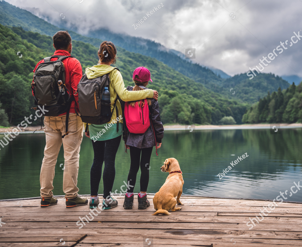 Family on dock with dog.
